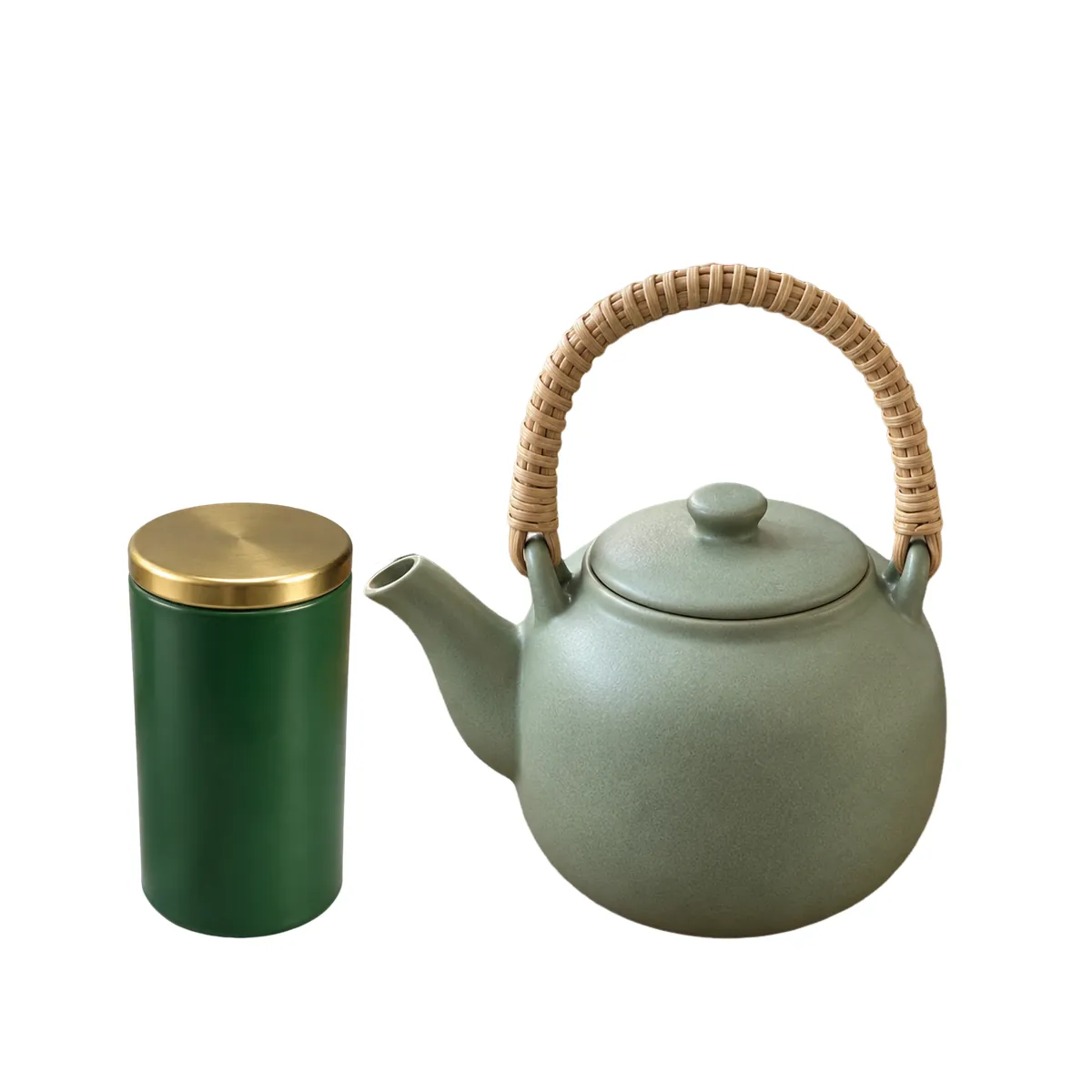 The same teapot on white with a green tea tin with a brass lid standing beside it