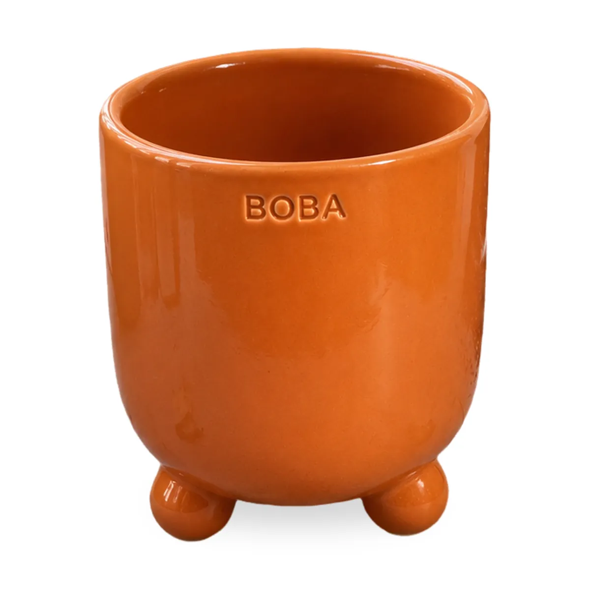 The same orange planter cut out and centred on pure white with a soft shadow