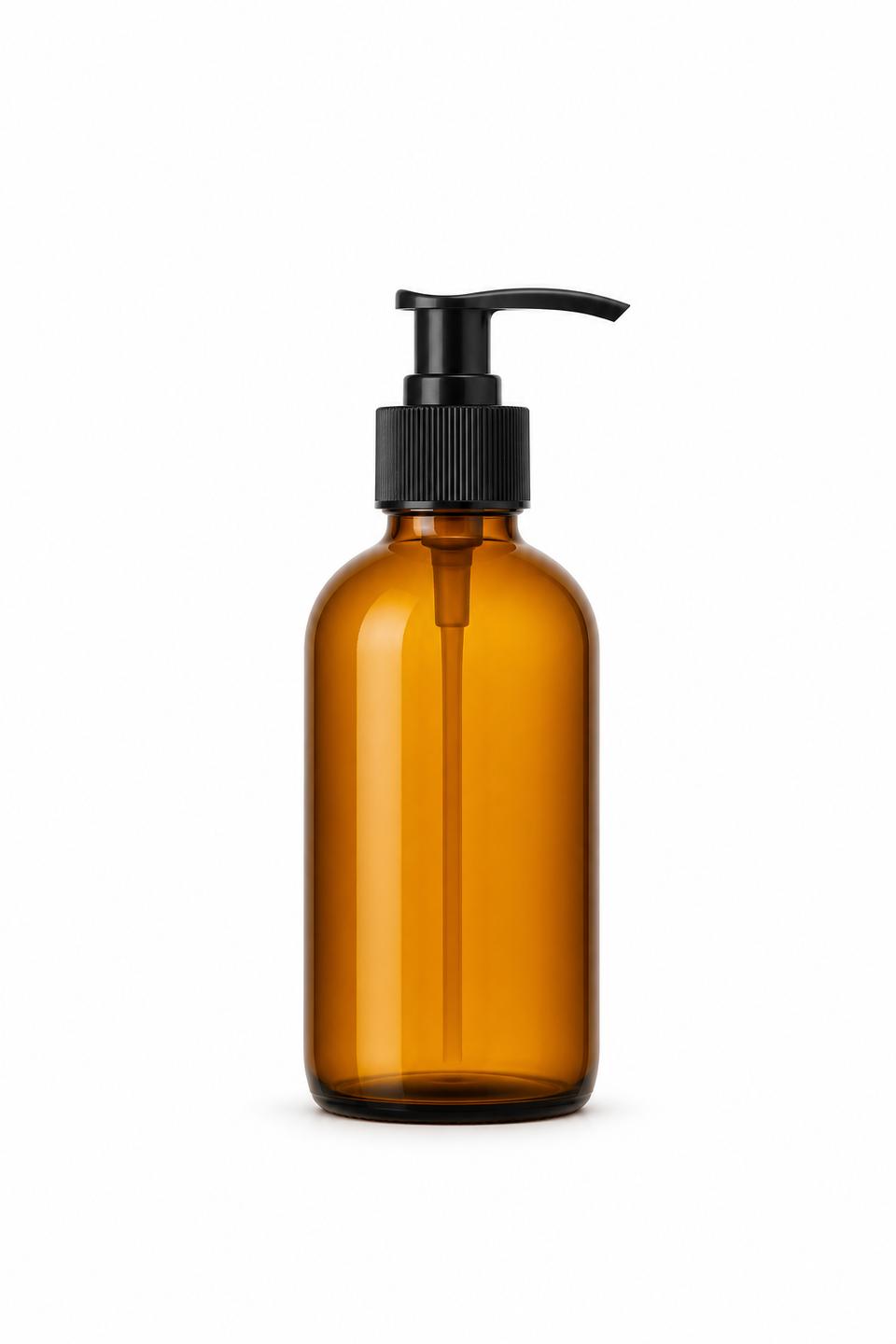 Finished catalog shot of the same amber pump bottle on pure white